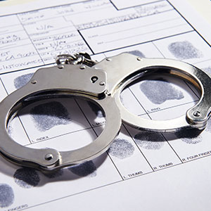 A handcuffs on a document - Serving Immigrants
