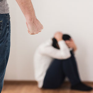 A man yelling at a women - Serving Immigrants