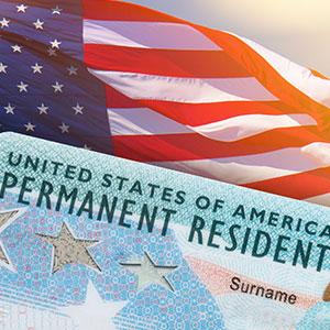 US passport with American flag in background - Serving Immigrants
