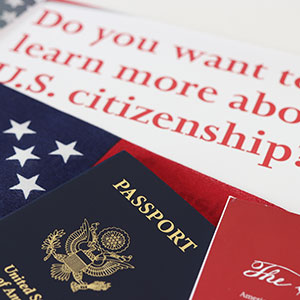 A photo of a US citizenship application form with passport - Serving Immigrants