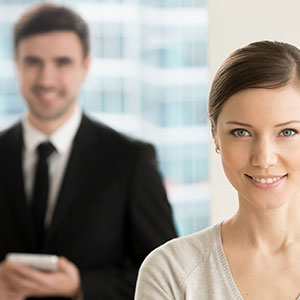 Image of a woman with smiling face - Serving Immigrants