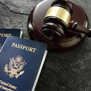 A gavel and two passports - Serving Immigrants