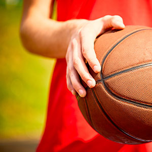 A man holding a basketball - Serving Immigrants