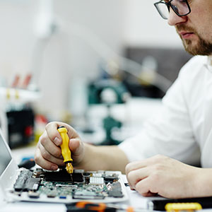 A person working on a computer - Serving Immigrants