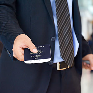 A person holding a passport - Serving Immigrants