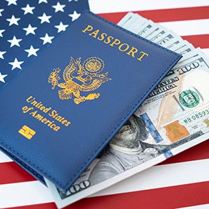 A passport and money on a flag - Serving Immigrants