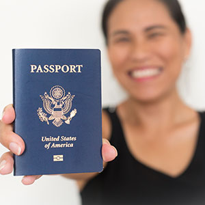 A women holding a password - Serving Immigrants