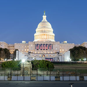 A white building with a dome - Serving Immigrants