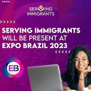 A women sitting at a desk with a laptop - Serving Immigrants