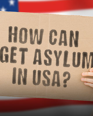 A person holding a banner, American flag on background - Serving Immigrants