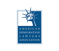 A blue and white logo with a statue of liberty - Serving Immigrants